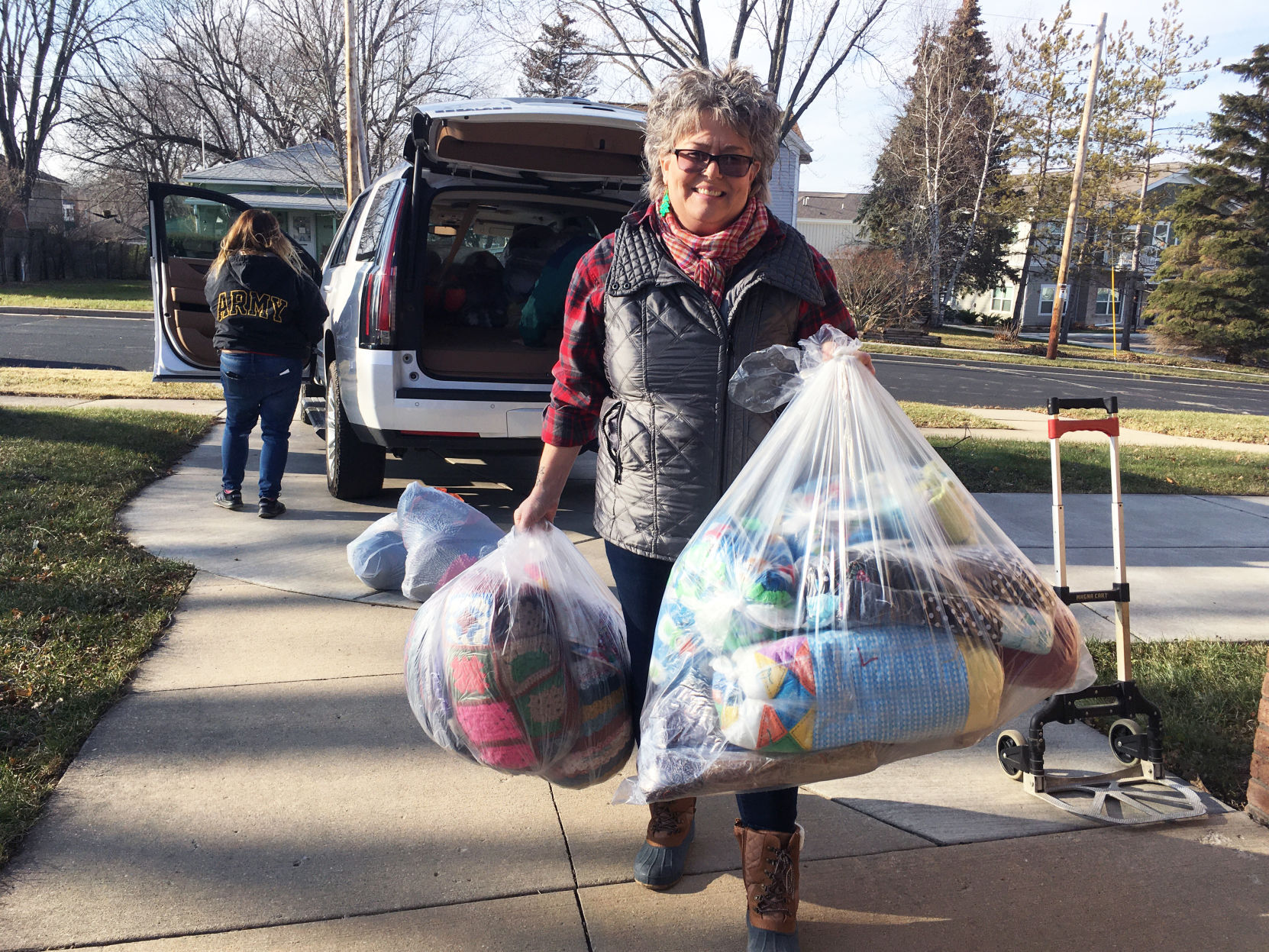 Kim Hemphill delivers blankets donated for gift bags going to veterans home